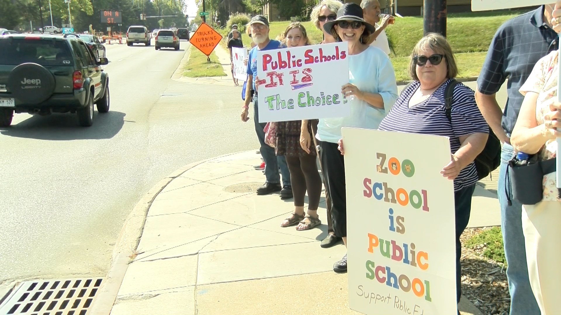 Protesters gather in response to Devos visit