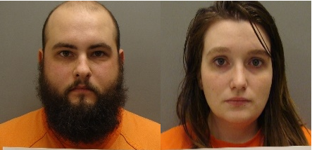 Couple arrested after one twin girl dies, other hospitalized
