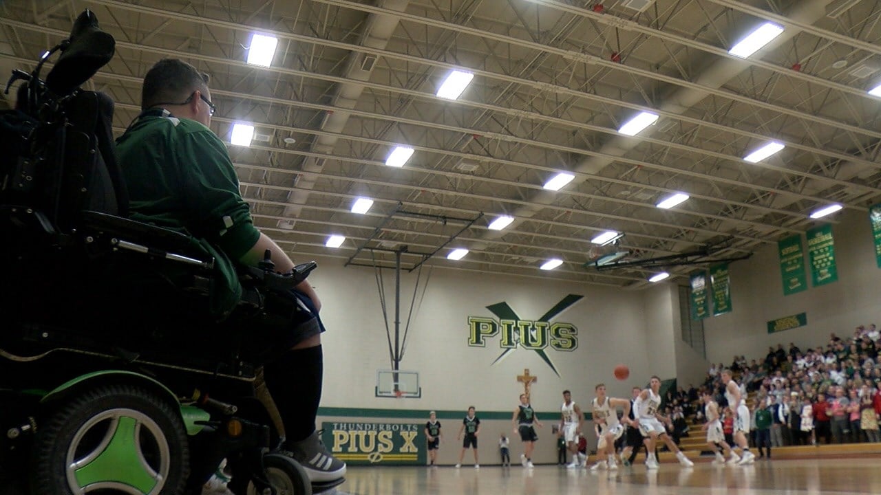 Pius X boys basketball inspired by team manager's contagious optimism