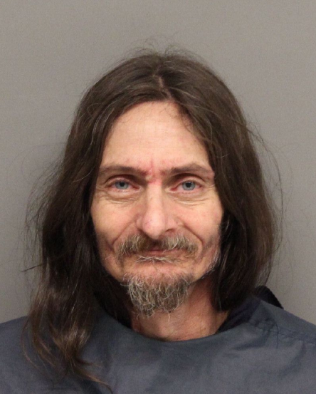 Lincoln man cuts one person and threatens others with machete