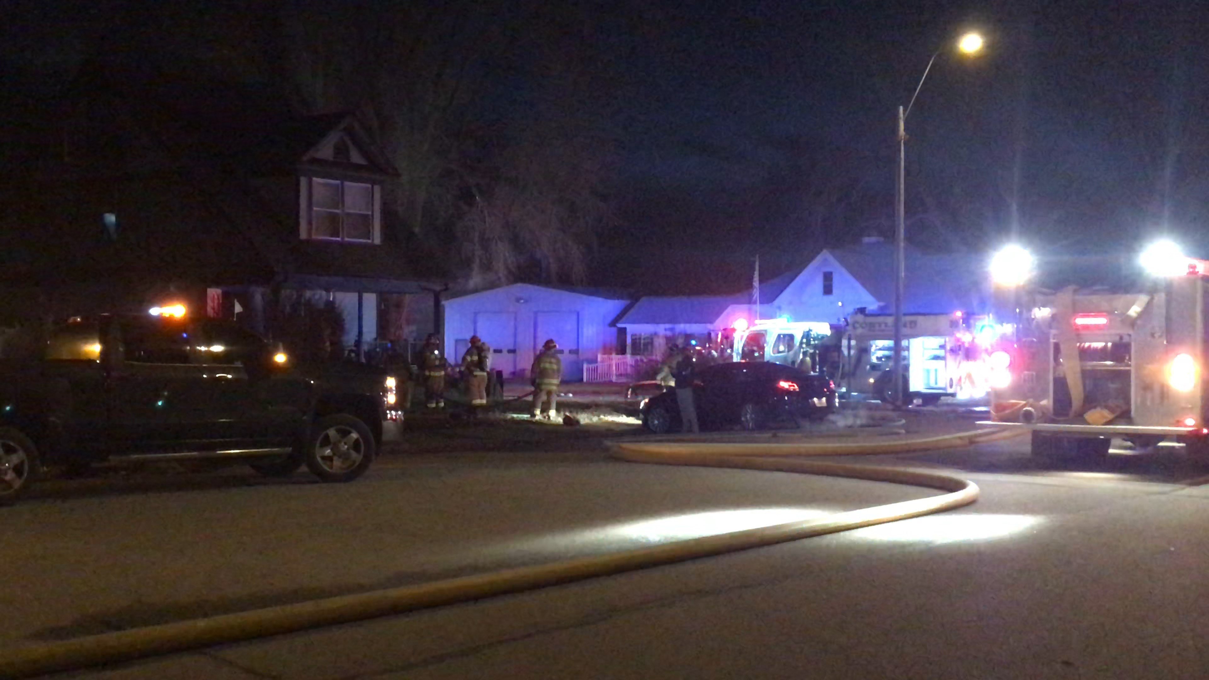 Multiple departments battle Cortland house fire